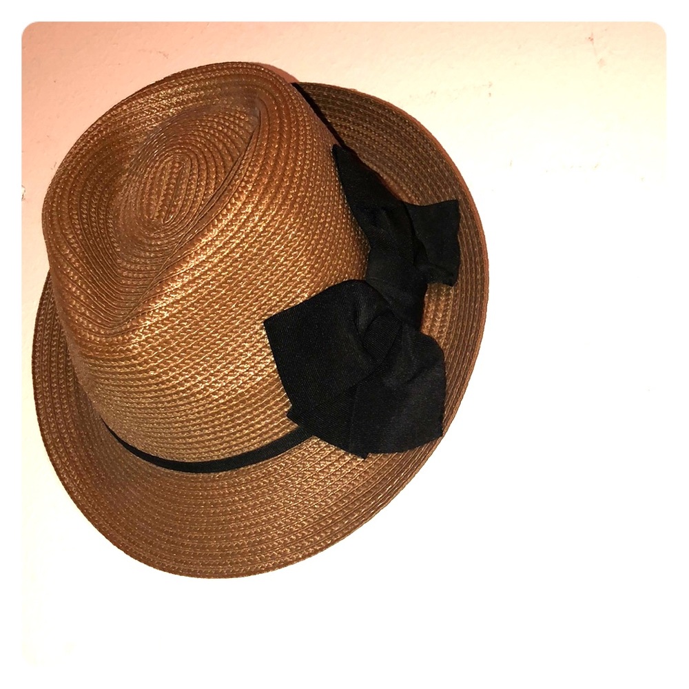 A Hat with a signature black bow.